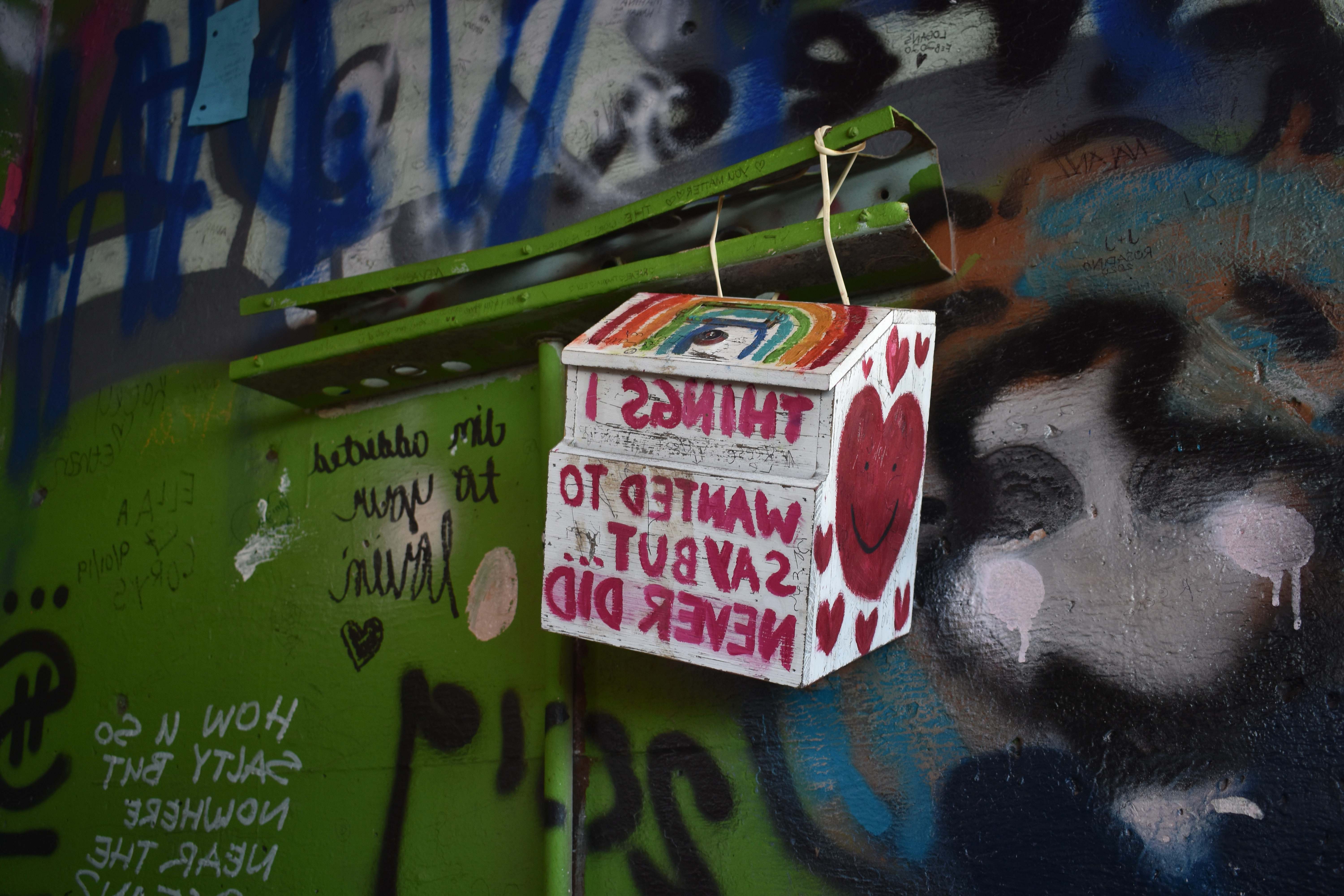 Graffiti White And Red Labeled Box Mural Image Free Photo