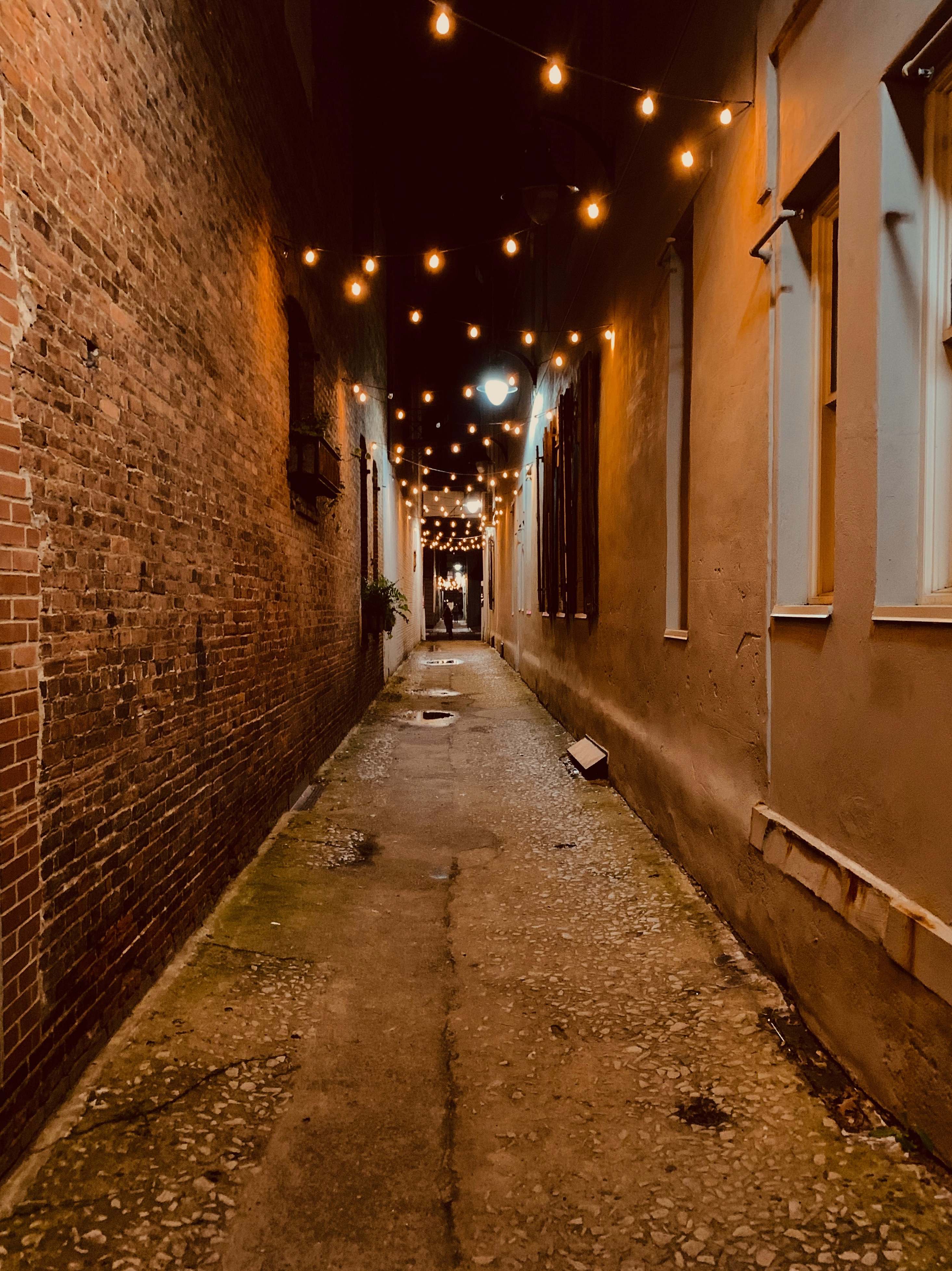 city alley with hanging lights during night corridor Image - Free Stock ...