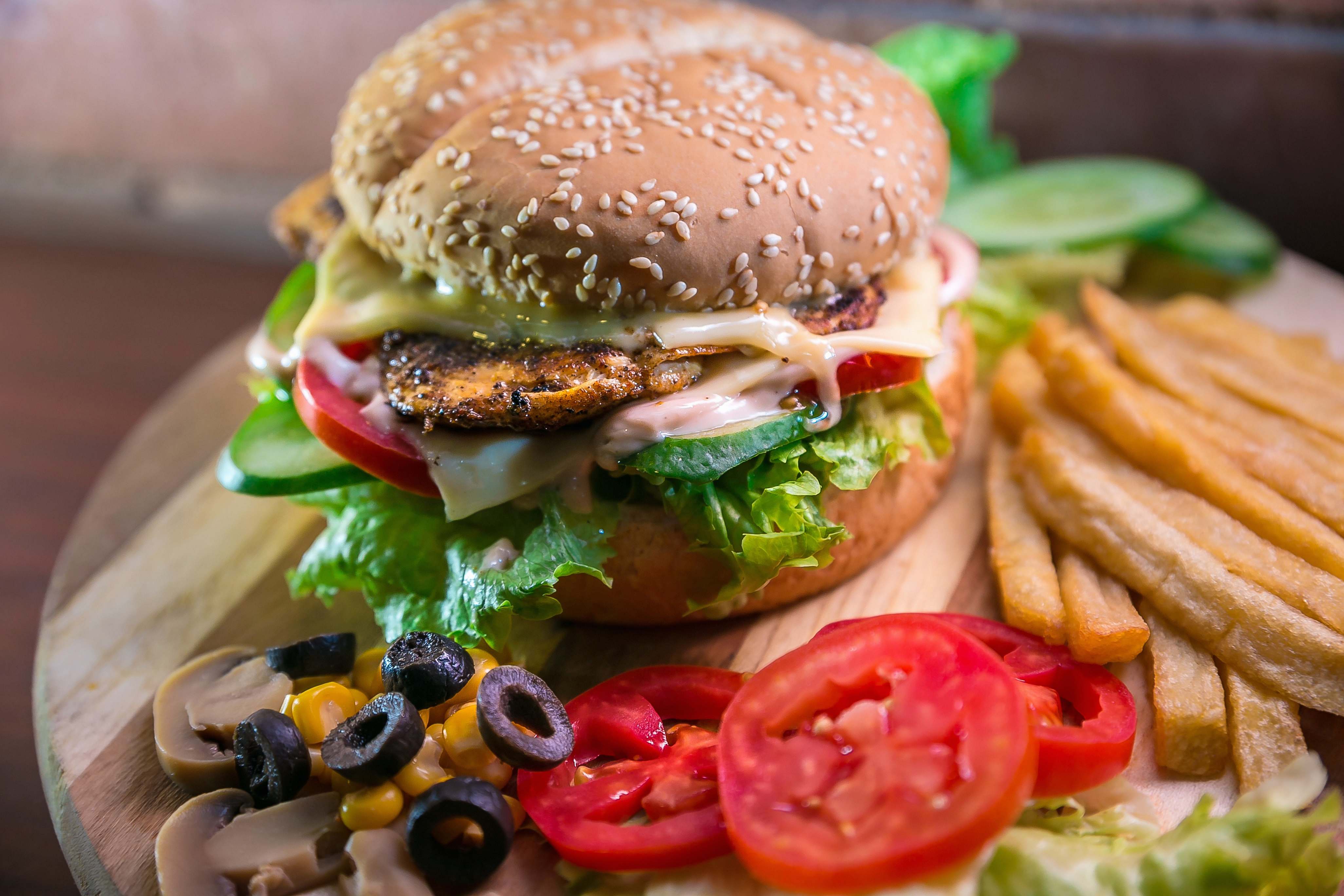 Burger Hamburger With Vegetables And Meat Beside French Fries Donut ...