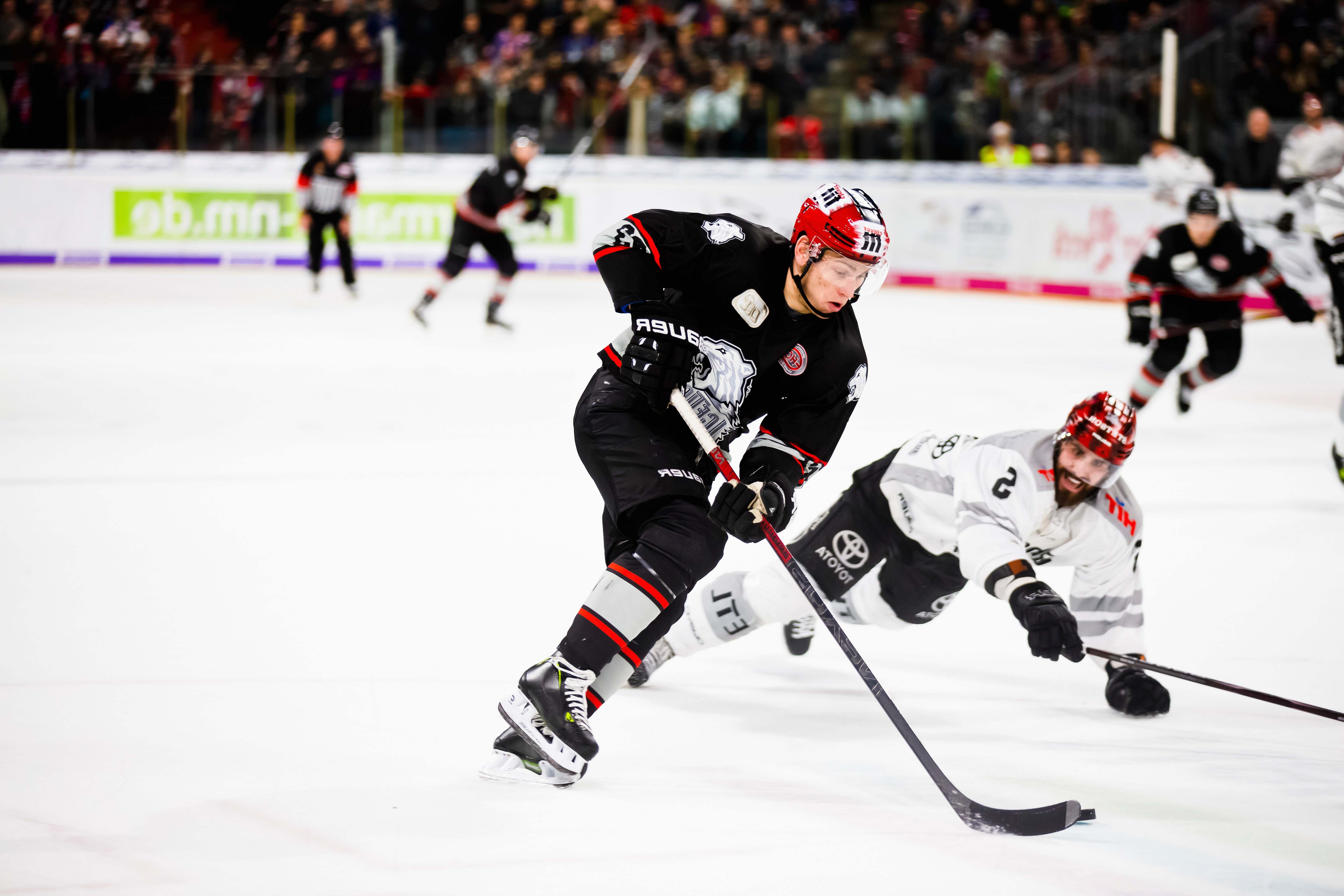 human hockey players in hockey field playing hockey Image Free Stock