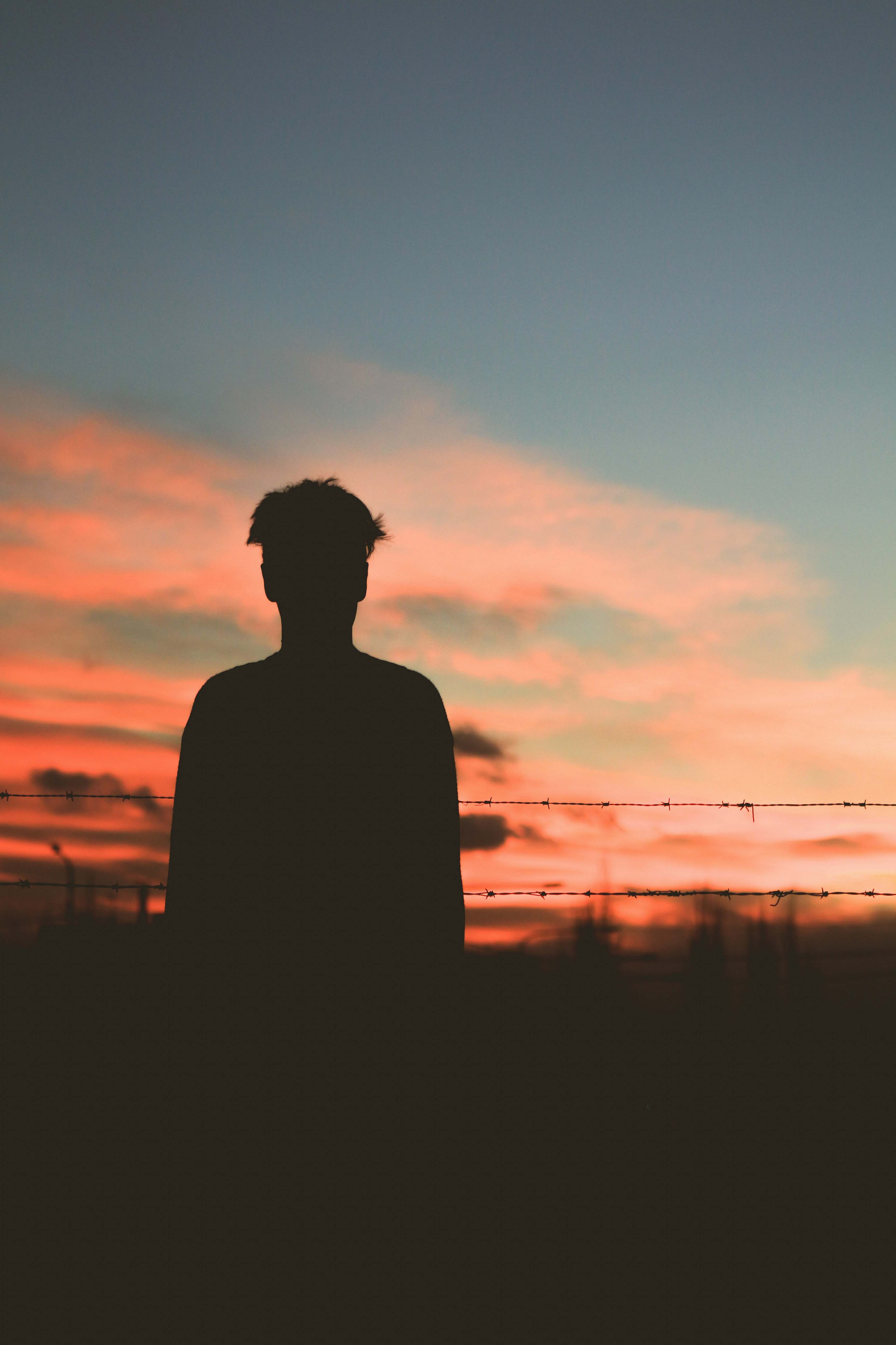 Silhouette Silhouette Of Man Standing In Front Of Fence Human Image ...