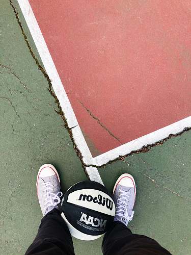 clothing person wearing black and white converse all star sneakers footwear