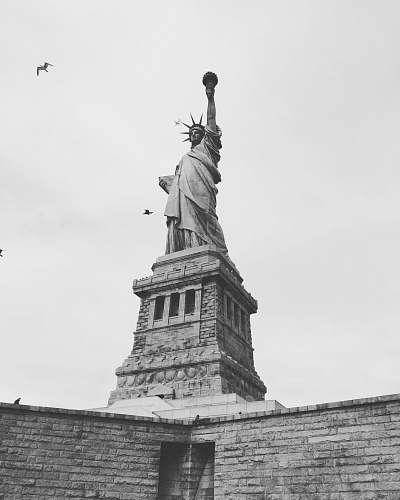 grey grayscale photography of Statue of Liberty new york