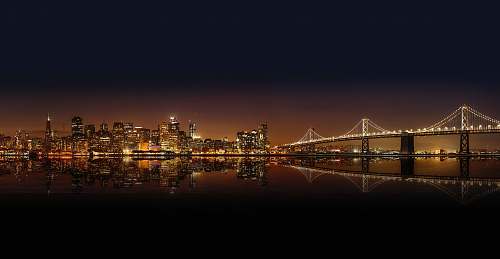 building cityscape photography of lighted city with bridge city