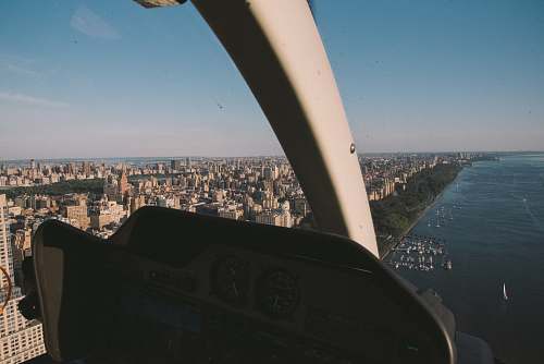 city aerial photography of buildings beside sea metropolis