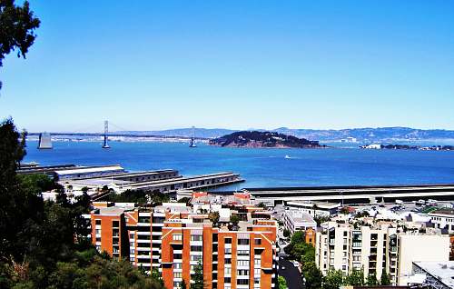 city bird's eye view photo of orange high rise building san francisco