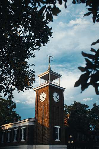 tower brown and white tower clock architecture