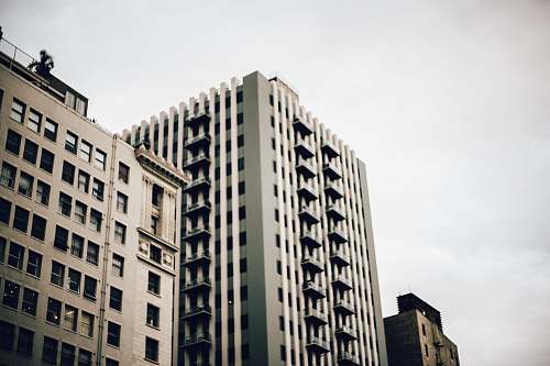 downtown high-rise building under nimbus clouds architecture