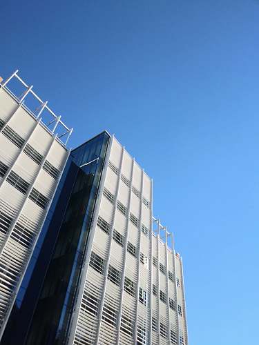 housing low angle photography of white highrise building screenshot architecture