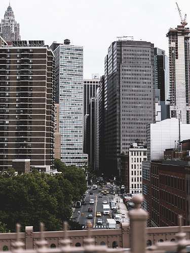 urban photo of brown and white high rise buildings during daytime brooklyn bridge