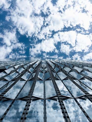 building close-up photography of high-rise building under cloudy sky during daytime new york