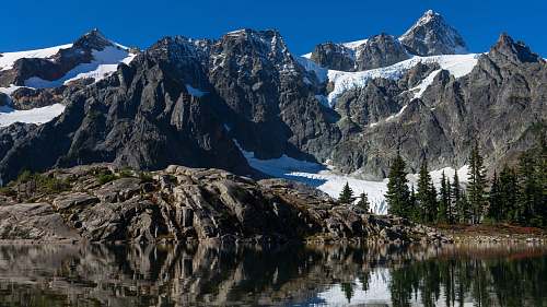 mountain gray mountains under blue sky mountain range