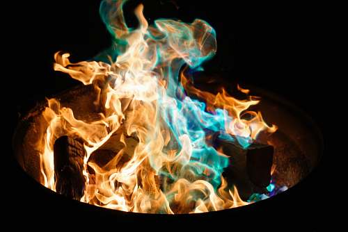 flame orange and blue flame on pile of wood broomall