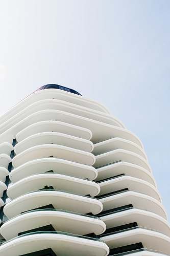 building white concrete structure during daytime housing