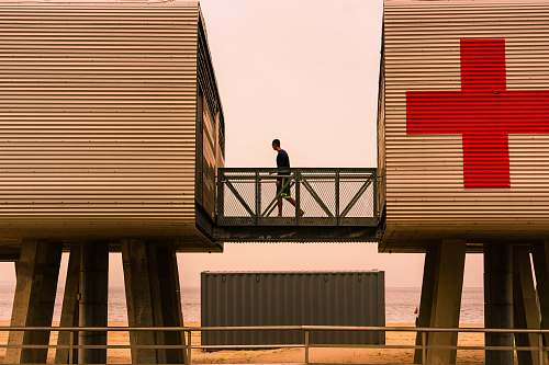 banister person standing on intermodal container railing