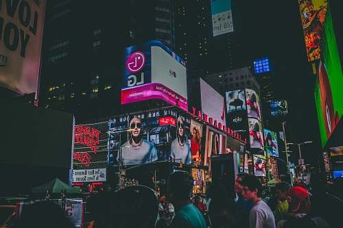 person people in busy city street at night musical instrument