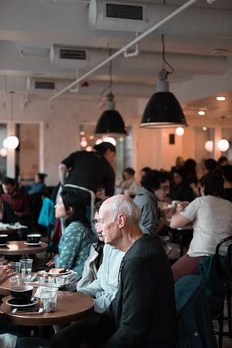 person people sitting and gathering inside building restaurant