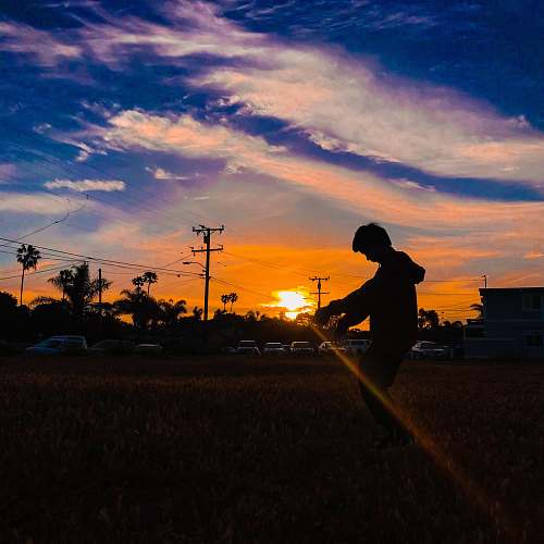 person silhouette of boy outdoors