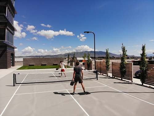 person two men playing tennis sport