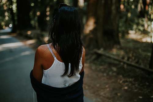 person woman wearing white tank top with black blazer people