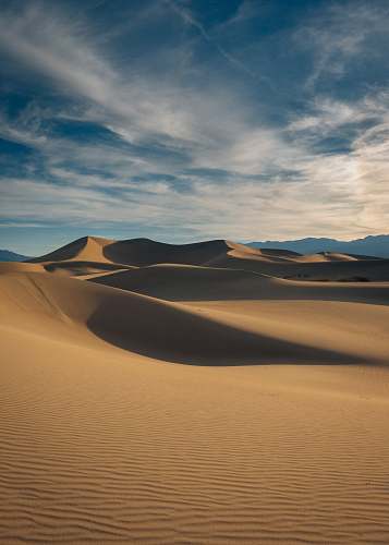outdoors brown desert under blue sky soil