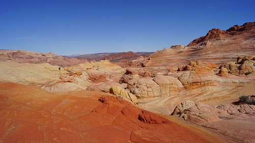 outdoors brown rock formations under blue sky mountain