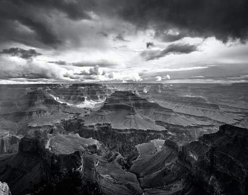 black-and-white landscape photo of grand canyon storm