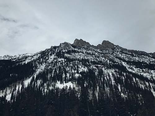 outdoors low angle photography of mountain during daytime mountain