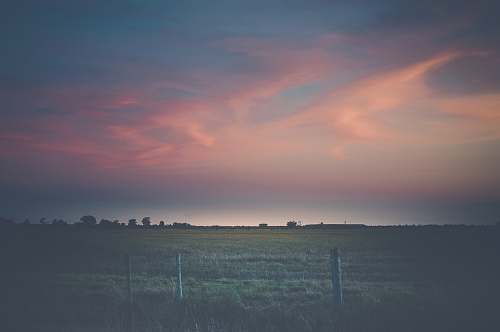 outdoors low light photography of grass field sky