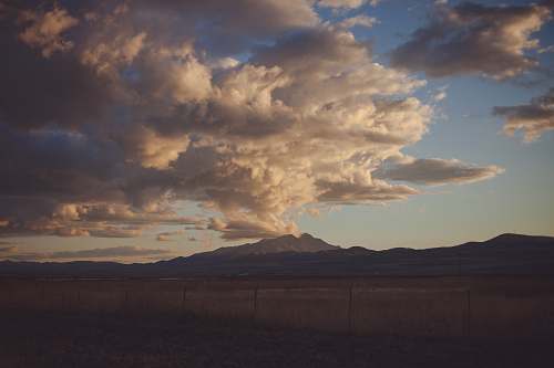 weather mountain under white and gray skies cloud