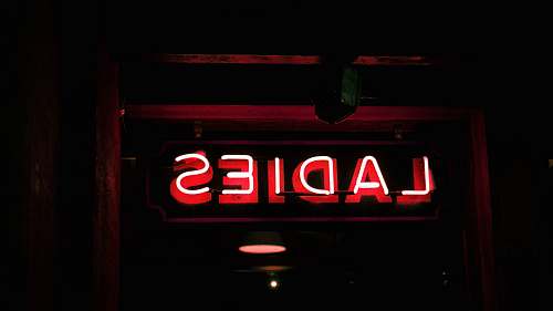 light red neon light signage chelsea market