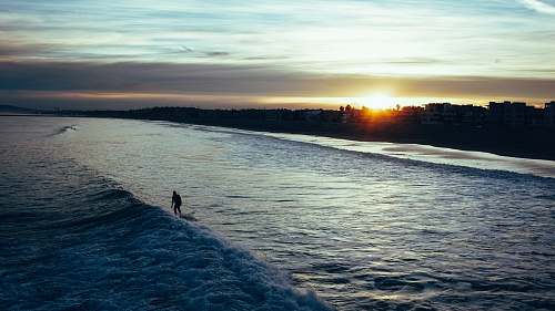 nature silhouette of person on lake ocean