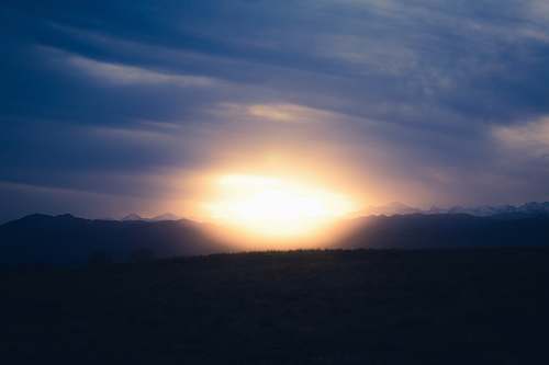 sky silhouette photography of mountain sun