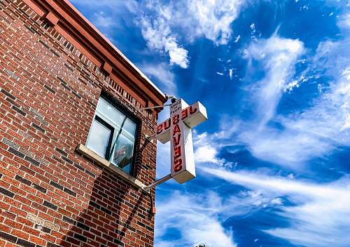 nature white Jesus Saves cross sign brick