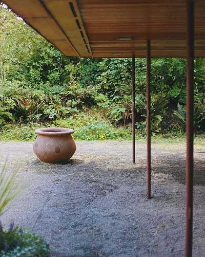 porch brown clay pot on pavement gordon house