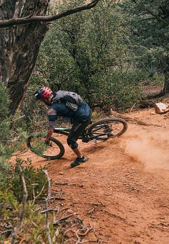 person man on bike on downhill trail human