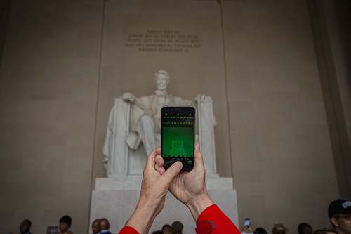 electronics person holding black smartphone cell phone
