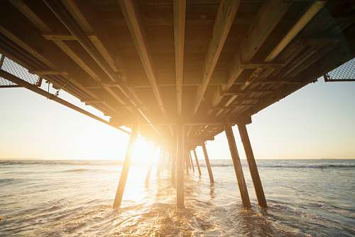 dock architectural photography of wooden bridge beach