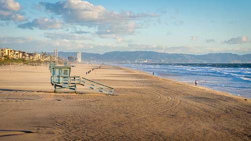 ocean blue wooden watch tower on shore nature