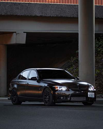 vehicle shallow focus photo of black BMW sedan car