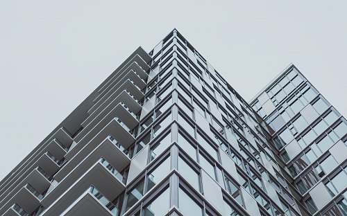 city architectural photography of gray building high rise