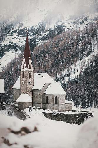 tower aerial photography of a cathedral covered with snow spire