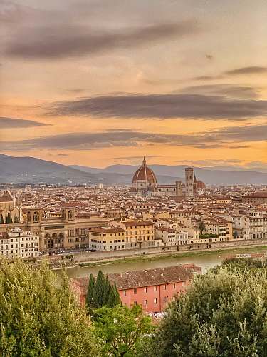 building aerial photography of Florence, Italy under white and orange sky during daytime dome