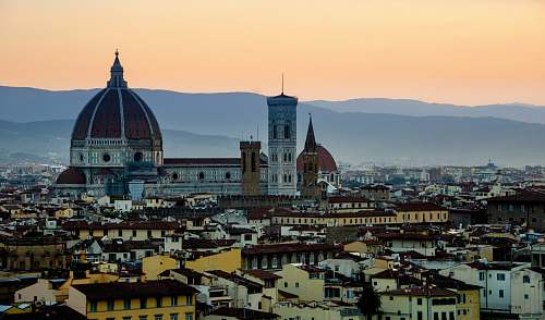 building aerial photography of houses across cathedral at daytime dome