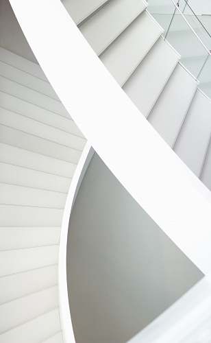 black-and-white aerial photography of spiral stairs paper