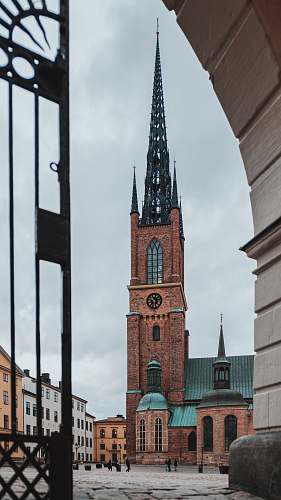building architectural photography of brown and black house tower