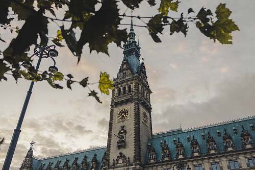 building architectural photography of gray and blue clock tower tower