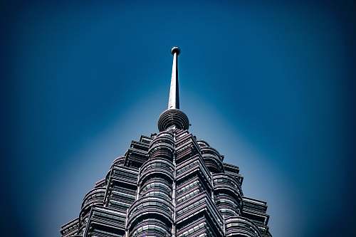 spire architectural photography of gray building steeple