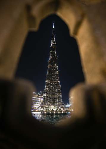 building architectural photography of lighted city building spire