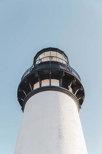 building architectural photography of white and black lighthouse tower